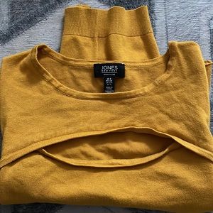 Mustard yellow, cleavage shirt.